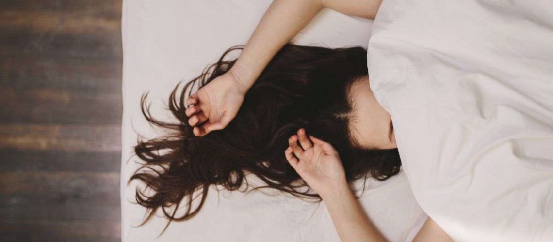 Woman trying to fall sleep